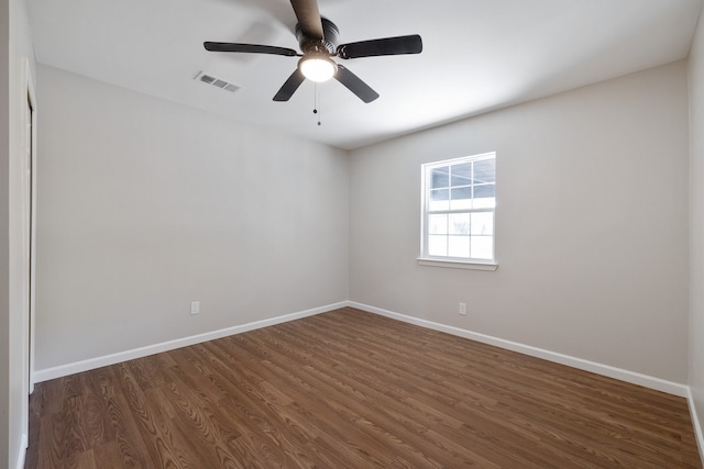 unfurnished room featuring ceiling fan and dark hardwood / wood-style floors