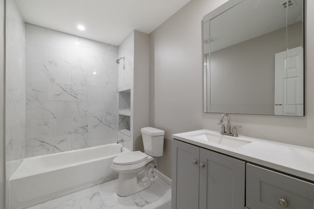 full bathroom featuring toilet, vanity, and tiled shower / bath