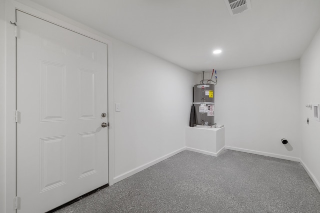 washroom with electric water heater and hookup for an electric dryer