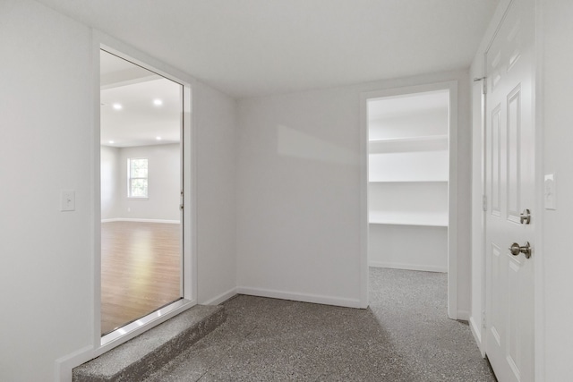 unfurnished room with hardwood / wood-style floors