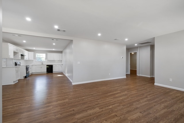 unfurnished living room with dark wood-type flooring and sink