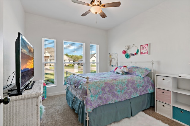 bedroom featuring light carpet and ceiling fan