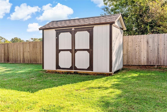 view of outbuilding featuring a yard