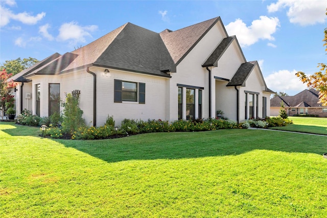 view of property exterior featuring a lawn