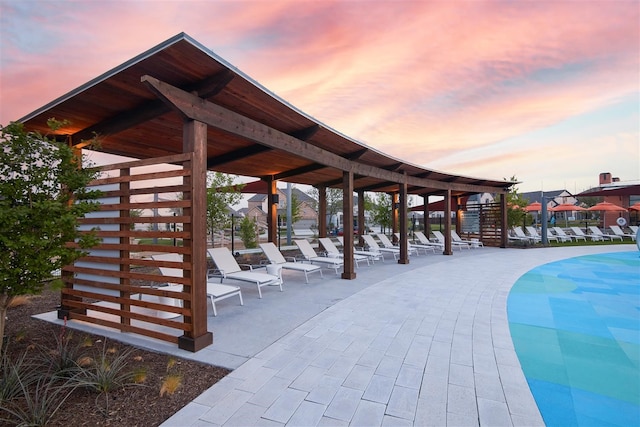 surrounding community featuring a pool and a patio area