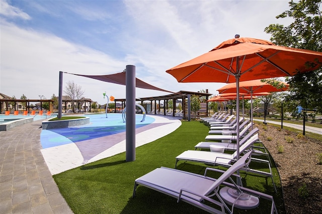 view of swimming pool with a yard and a patio area