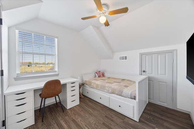 bedroom with built in desk, lofted ceiling, ceiling fan, and dark hardwood / wood-style flooring