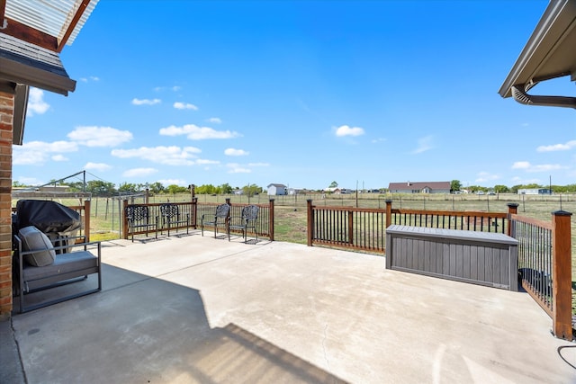 view of patio with a rural view