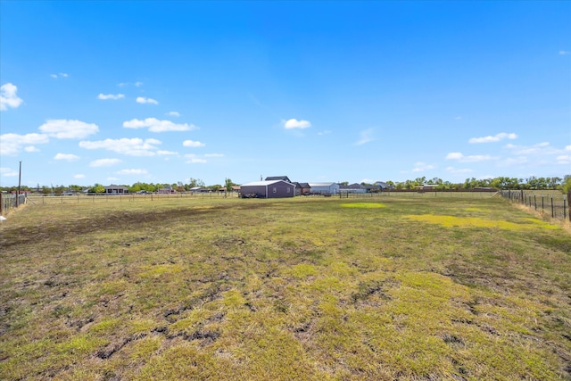 view of yard with a rural view