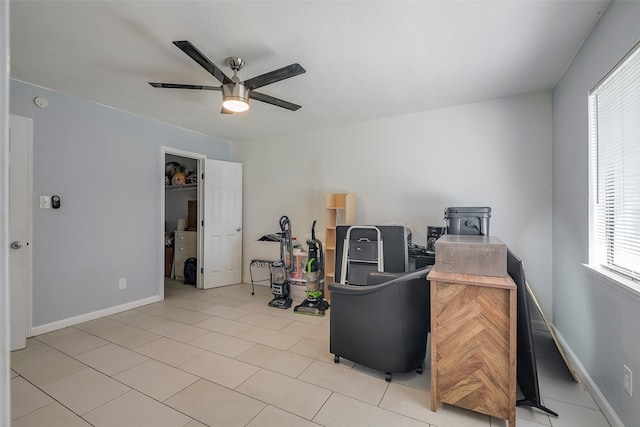 tiled office space featuring ceiling fan