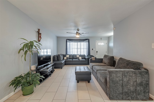 tiled living room featuring ceiling fan