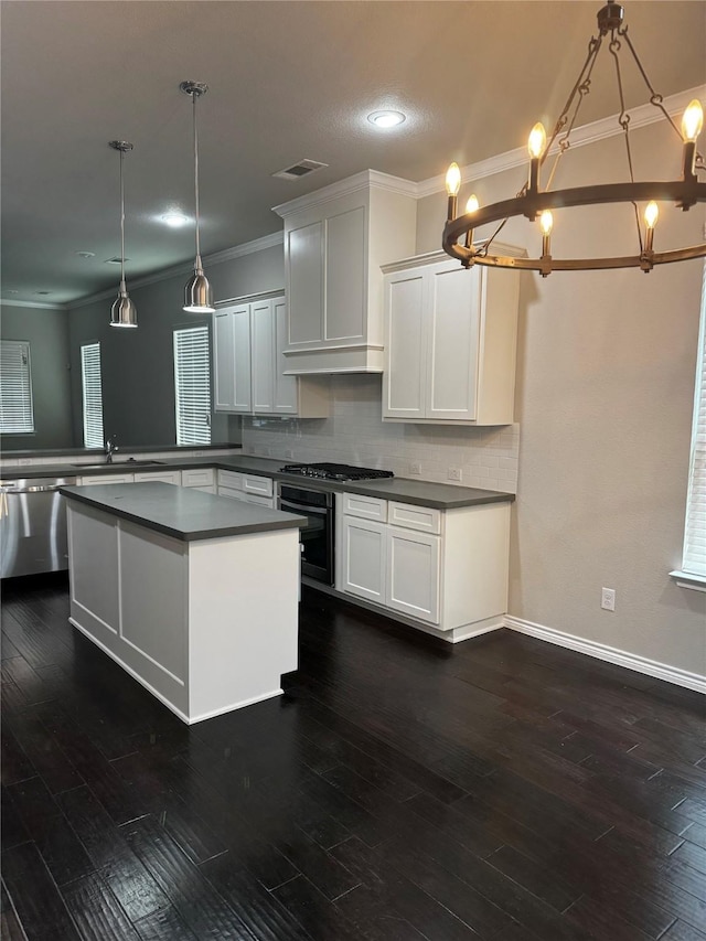 514 Sheer Bliss Ln, Fort Worth, TX 76114 - kitchen featuring stainless steel appliances, a chandelier, dark countertops, tasteful backsplash, and ornamental molding