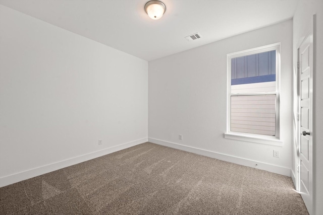 unfurnished room featuring carpet