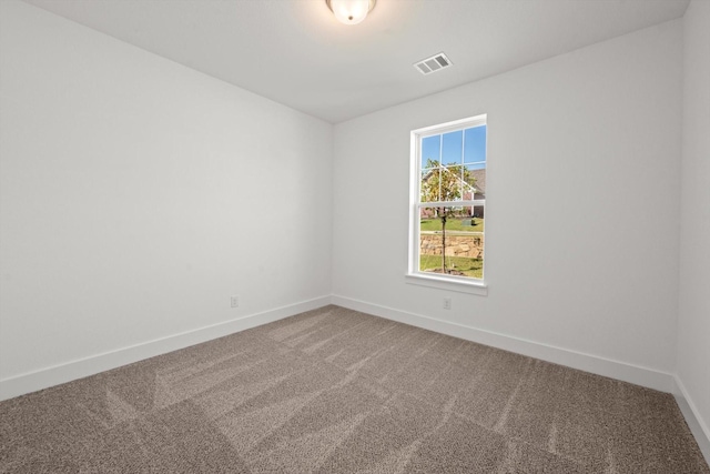 empty room with carpet flooring