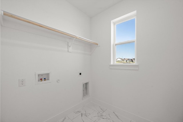 clothes washing area featuring washer hookup, hookup for a gas dryer, and electric dryer hookup