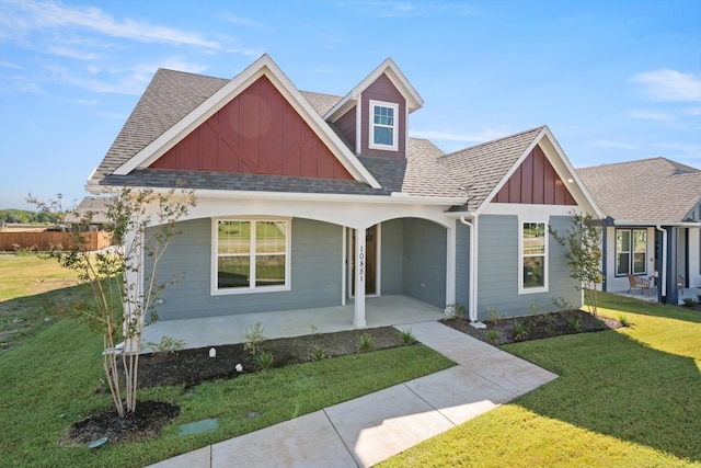 view of front of property with a front lawn and a porch