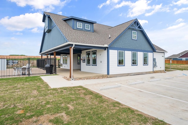 rear view of property with central AC and a patio