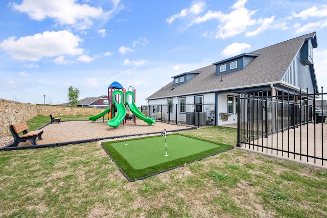 view of play area featuring a lawn