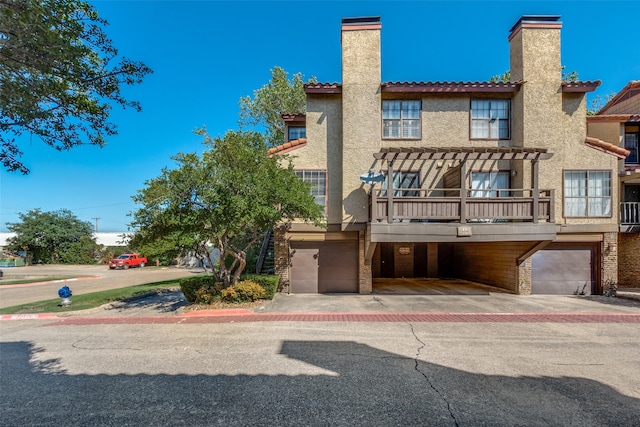 rear view of property with a garage