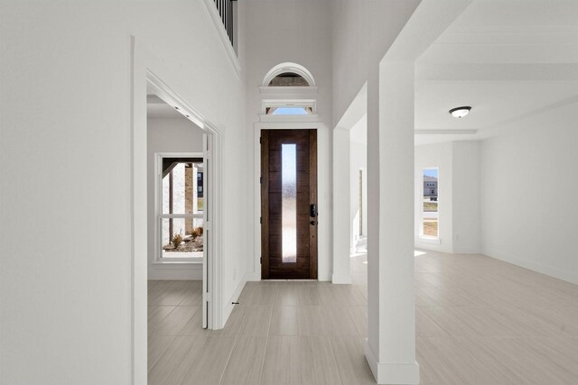 entryway with light tile patterned floors