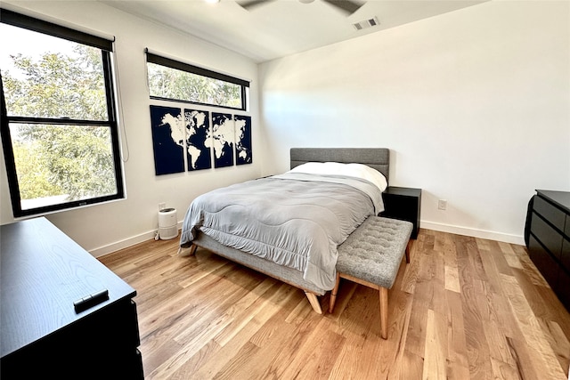 bedroom featuring light wood-type flooring and ceiling fan