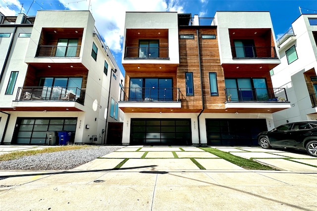 view of front of house featuring a balcony and a garage