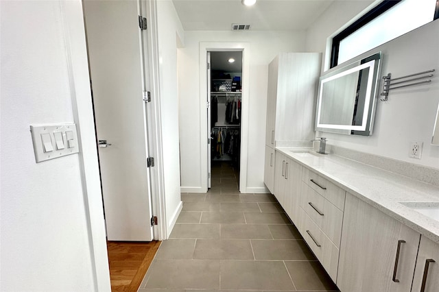 bathroom featuring tile patterned floors and vanity