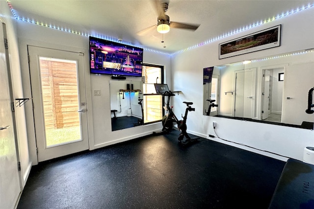 exercise room with ceiling fan