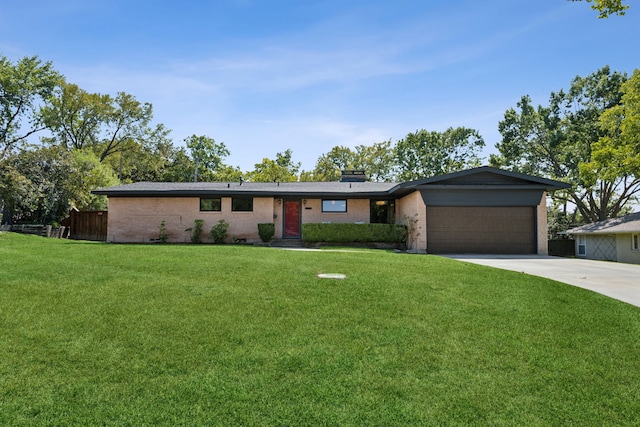 ranch-style house with a front yard and a garage