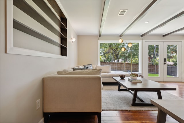 living room featuring beamed ceiling, french doors, and dark wood-type flooring