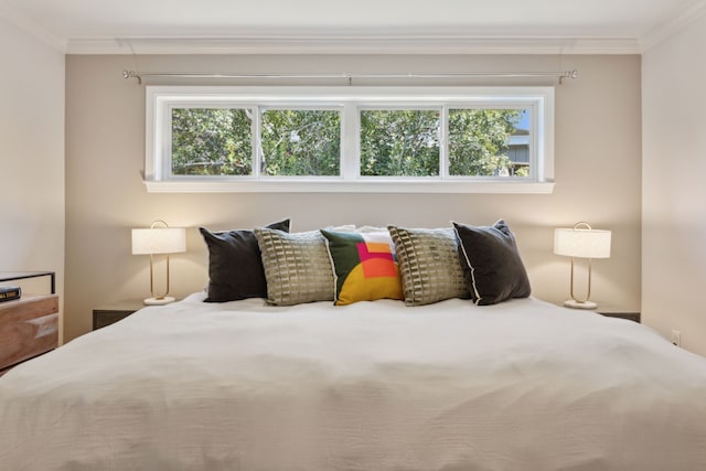 bedroom featuring crown molding