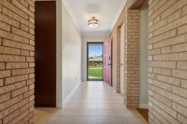 doorway to outside featuring light tile patterned floors and ornamental molding