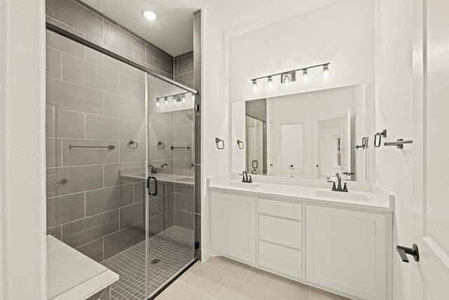 bathroom with vanity, tile patterned floors, and walk in shower