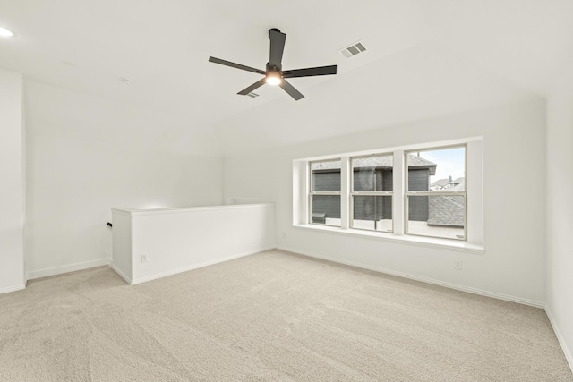 interior space featuring light carpet and ceiling fan