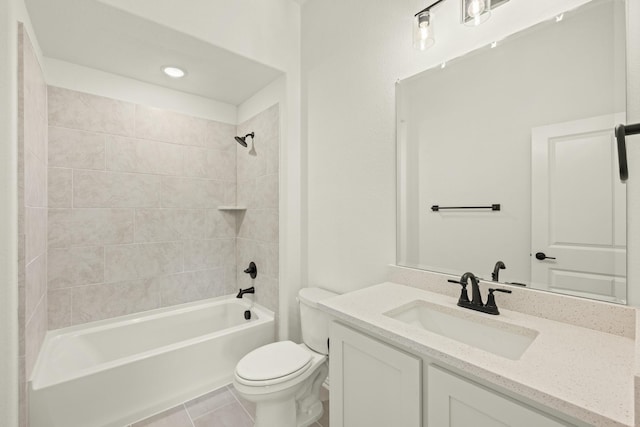 full bathroom with tiled shower / bath, vanity, toilet, and tile patterned flooring