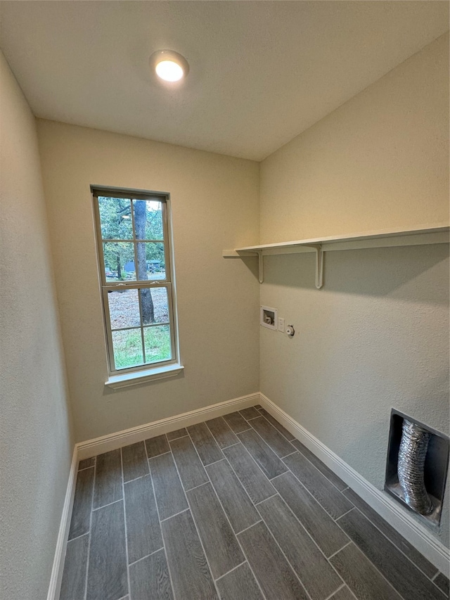 laundry room with hookup for a washing machine and dark wood-type flooring