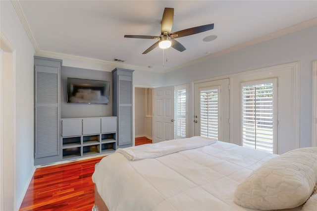 bedroom featuring ornamental molding, ceiling fan, and hardwood / wood-style flooring