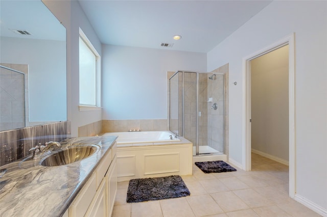 bathroom with vanity, shower with separate bathtub, and tile patterned floors