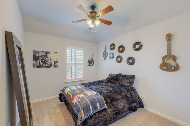 bedroom featuring light carpet and ceiling fan