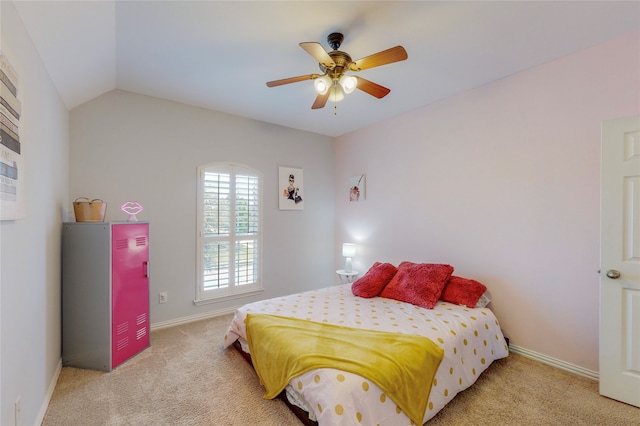 bedroom with light carpet, vaulted ceiling, and ceiling fan