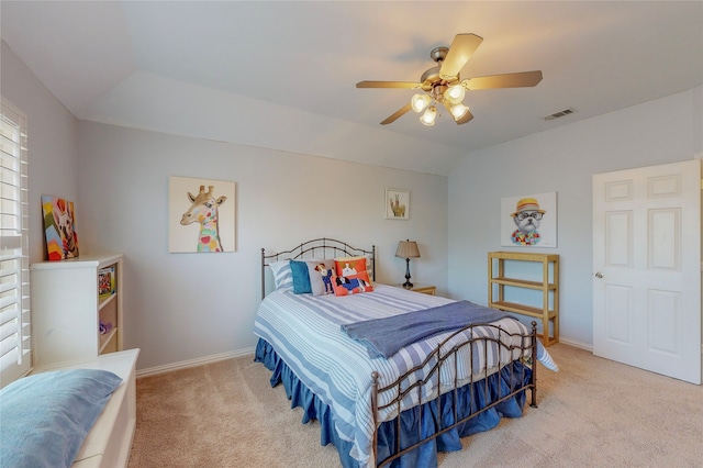 carpeted bedroom featuring vaulted ceiling and ceiling fan