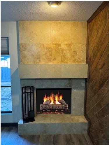 311 Oak Shadow Cir, Bedford, TX 76021 - detailed view of a fireplace, wood finished floors, and a textured ceiling