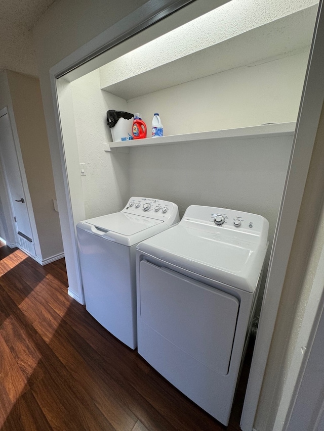 311 Oak Shadow Cir, Bedford, TX 76021 - laundry room featuring dark wood-type flooring, washing machine and dryer, and baseboards