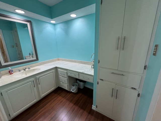 311 Oak Shadow Cir, Bedford, TX 76021 - bathroom featuring wood finished floors, vanity, and recessed lighting