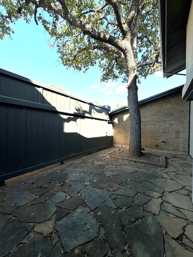 311 Oak Shadow Cir, Bedford, TX 76021 - fenced backyard featuring a patio