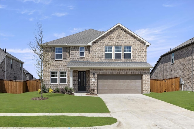 view of front of house with a garage and a front lawn