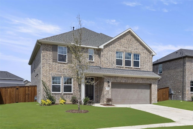 view of front facade with a garage and a front yard