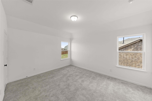 empty room featuring light colored carpet