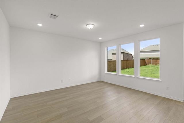 empty room with light hardwood / wood-style floors