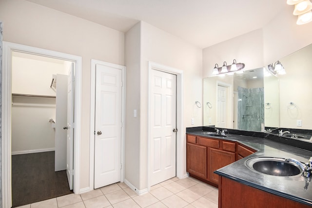 bathroom with vanity, tile patterned floors, and an enclosed shower